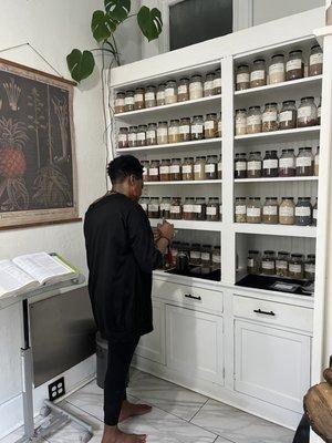 Maria mixing herbs for tea