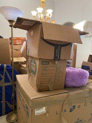 Boxes so high in the dining room you can barely see the chandelier