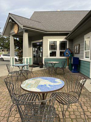 3 cafe tables on their patio