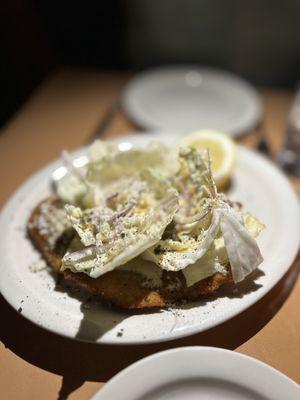 Pork milanese with cabbage, anchovies and horseradish