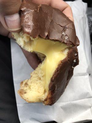 Glazed chocolate covered, Bavarian cream filled donut