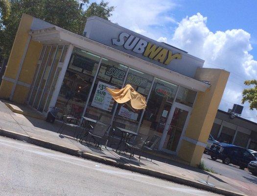 NO seating inside. Tables outside with a very sad looking umbrella that provides no cover