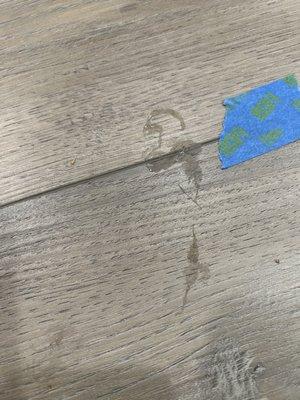 Caulk tracked throughout new flooring