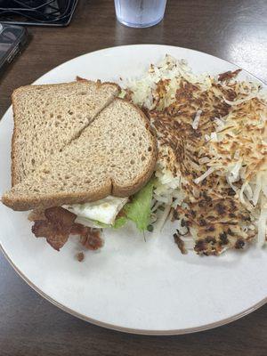 BLT sandwich added a fried egg & cheese but the cheese was forgotten with a side of "extra crispy" hash browns.