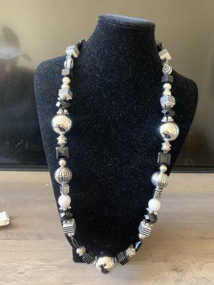 This necklace is a fun, awesome conversation , attention grabber with its larger silver ball beads, white smaller round beads,