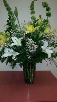 Elegant vase arrangement with 2 varieties of lilies as focal point