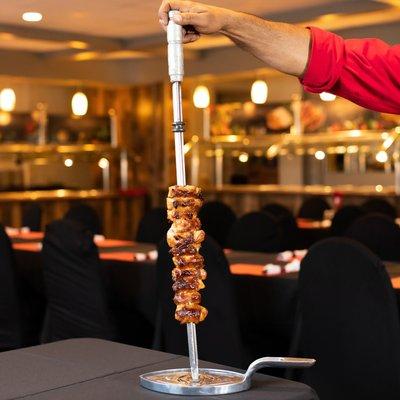 12 different types of meat which are presented on skewers and carved table side. www.cafemineirosteakhouse.com