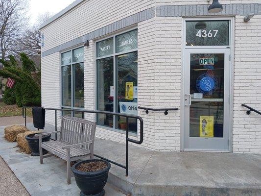 Front door, bench to enjoy your chocolate purchases