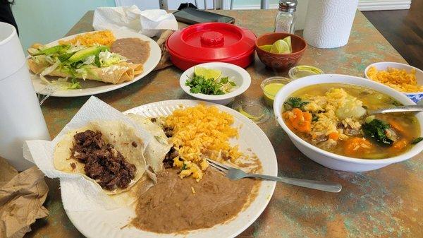 Caldo de res, flautas, taco de barbacoa and taco de fajitas