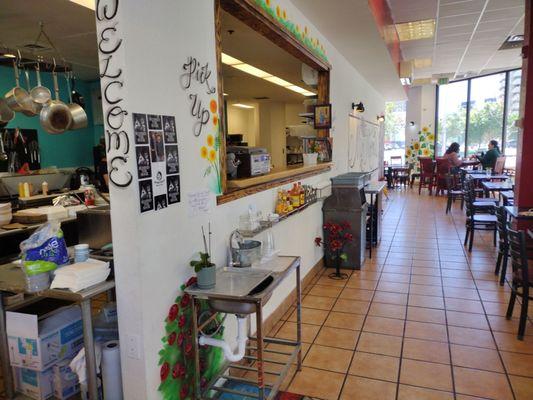 No waiter service.  Customer picks up cooked food on plates at this counter.