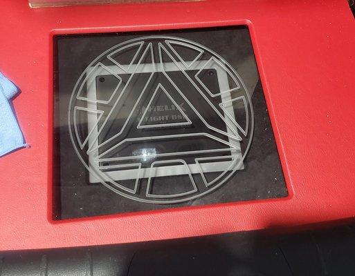 Custom amp rack in trunk with Iron man logo on the pixel glass.