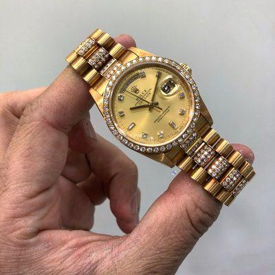 Rolex Yellow Gold day date 36mm reference 18348 original diamond dial, diamond bezel, and diamond bracelet.