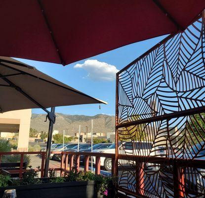 A great view of the mountains from the patio well covered with large umbrellas.