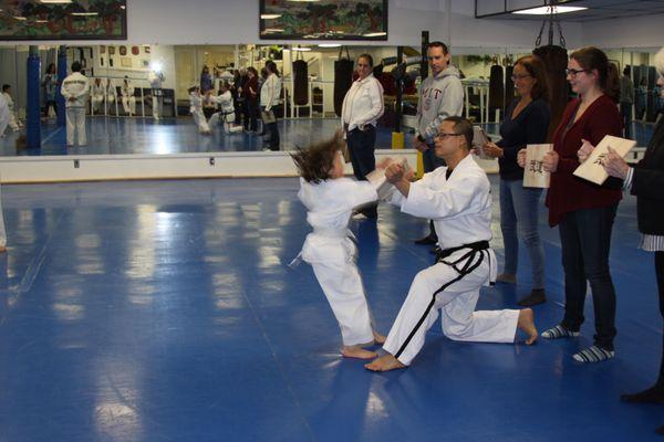 Board breaking on the kids belt promotion test.