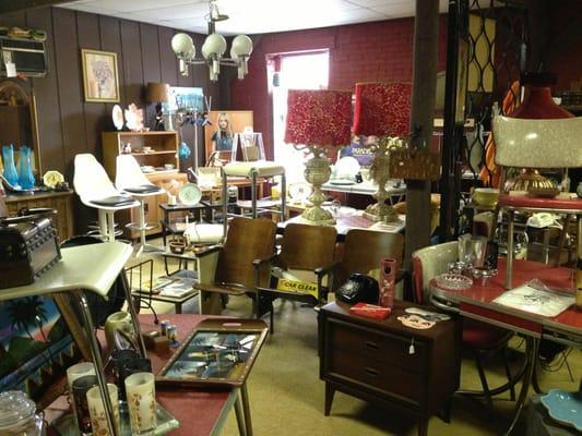 Upstairs and all the way to the left, awesome mid-century items.