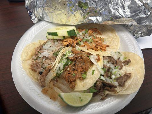 Four tacos: tinga (top), al pastor, and i forget