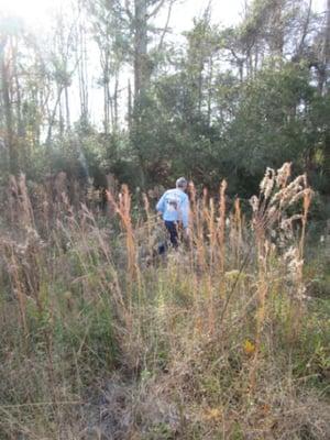 Richard going beyond the call of duty, walking the wetlands that were included in our home purchase!