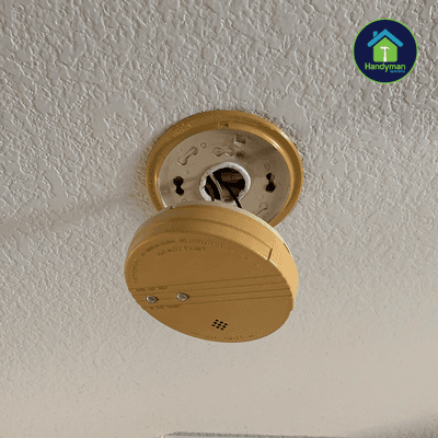 Smoke detector installation. Replacing an old yellowing smoke detector that is past the 10 year expiration date that was malfunctioning