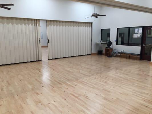 A reverse shot of the middle 2 dance rooms with the partition open and the partition to the main room closed.