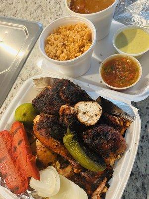 Pollo Asado, sausage, onions and jalapeños.  Sides: Rice, borracho beans and salsas.