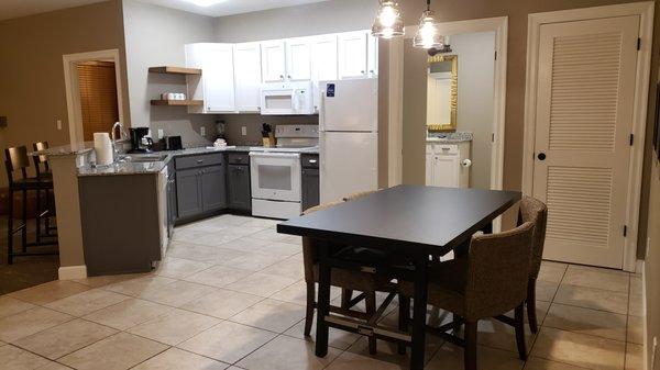 Looking from front door area onto dining and kitchen