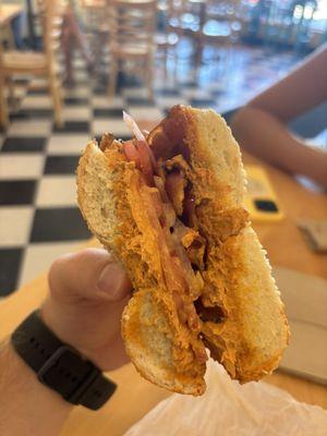 Sesame bagel with Jalapeno Cream Cheese, bacon, and onion