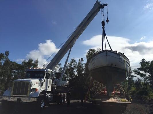 Dry docking boat in Orchidland, HI. 2013 Peterbilt with 50 ton Manitex crane.