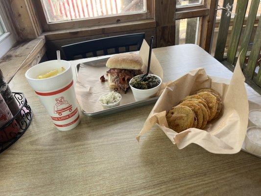 The Pig Boss, turnip greens, coleslaw, and fried green tomatoes