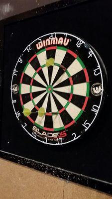 Dart board in back.