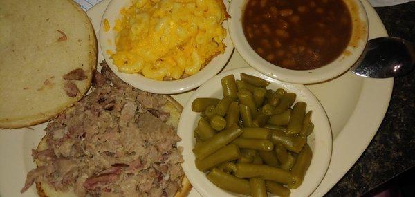 Barbecue pork, green beans, baked beans and mac and cheese.