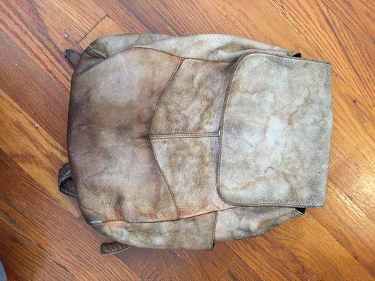 Water stained leather backpack