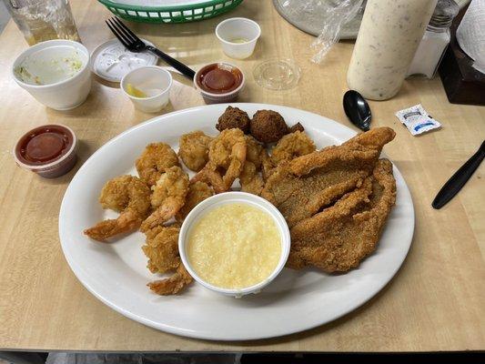 Cheese grits, fried fresh shrimp, cornmeal fried catfish filets, hush puppies, coleslaw