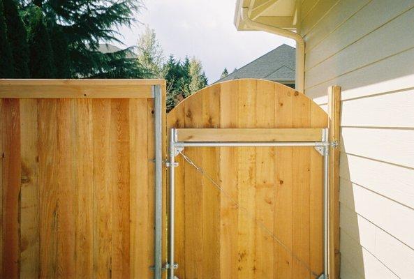 6' Wood Top Cap with a beautiful arch gate.