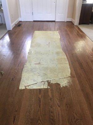 Area rug pad stuck on Hardwood Floor.