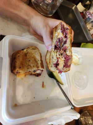 Pastrami Reuben with house-made potato chips and cole slaw