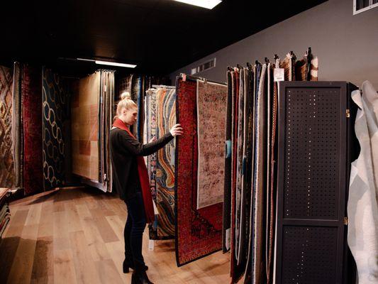 Sergenian's customer browsing large selection of area rugs.