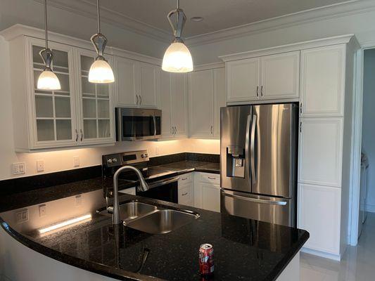 Painting the cabinets white gave the kitchen a more elegant look.