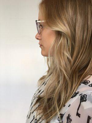 Sandy blonde Balayage and long layered haircut