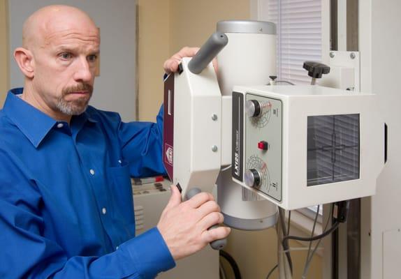 Dr. Connelly preparing to take an x-ray.