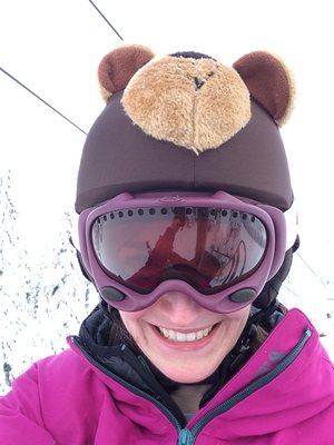 Volunteer ski instructor with a Teddy Bear helmet cover for the kids!