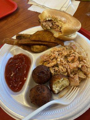 Chicken Plate - pulled chicken, hush puppies, potato wedges. The bun cost 30 cents since I opted for hush puppies.