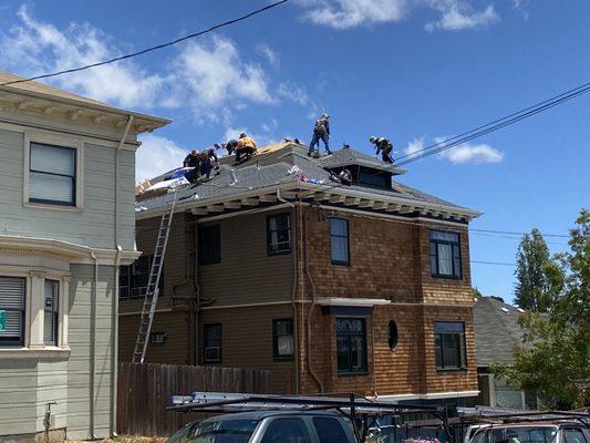 Roofers installing a roof