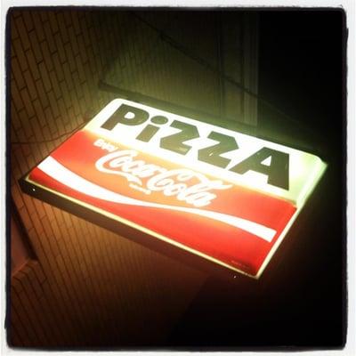 The iconic PIZZA sign at Frank's Pizzeria.