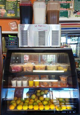 Fruits and premade drinks on refrigerated display