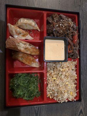 Bento box -bulgogi, fried rice, pan seared gyoza, egg rolls.