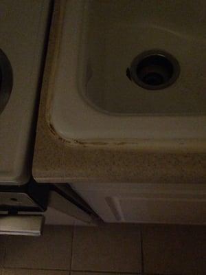 Eeewww. A bad caulking job, chipped sink, and just overall yuck.