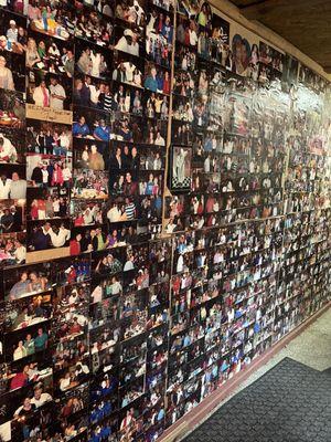 Wall of photos featuring Chef Jerome and customers.