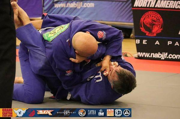 Curt about to sink in a front choke (1st place)