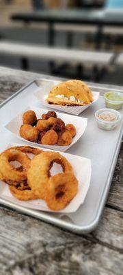 Onion rings, fried mushrooms and pulled pork puffy tacos