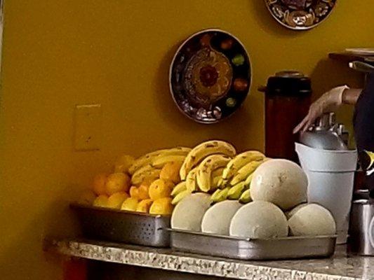 Piles of fresh fruit waiting to be freshly juiced.